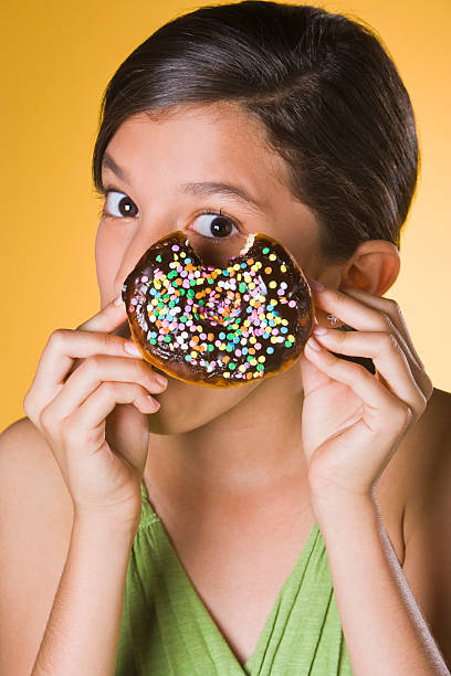 teenage girl with donut picture id182828303?k=6&m=182828303&s=612x612&w=0&h=QwXPlnip463HueJ p8RDW3r y W gTAYt IwcJziBsg=