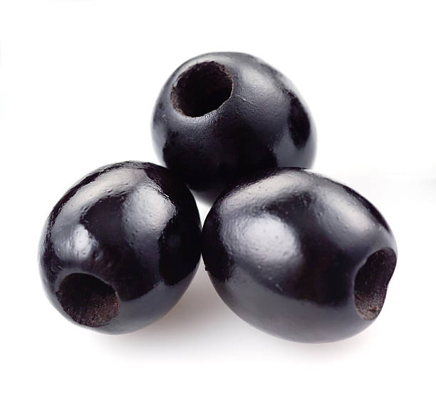 three-black-olives-isolated-on-white-picture-id164420419