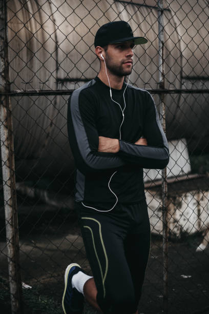 istock Young man next to the wire fence 1000008950