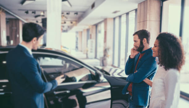 istock Couple buying new car 1000031132