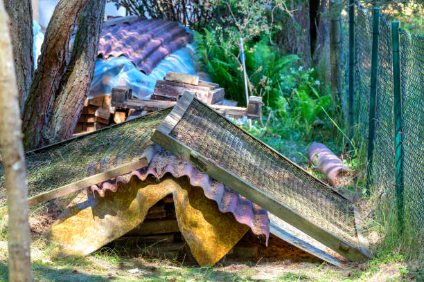 istock Broken construction debris near the fence.Old gates and boards 1000031952