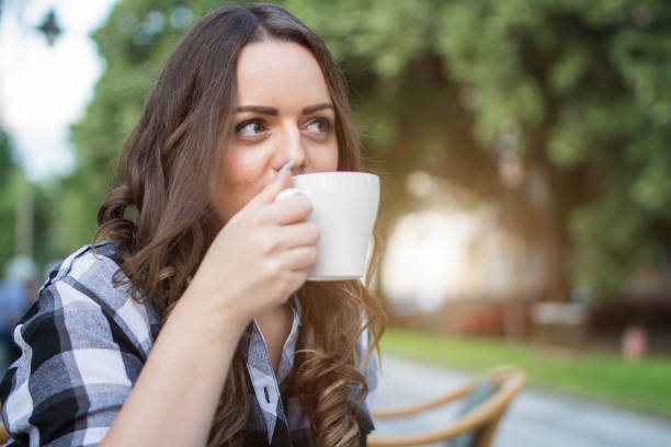 istock Beautiful young girl having a coffee brake 1000033304