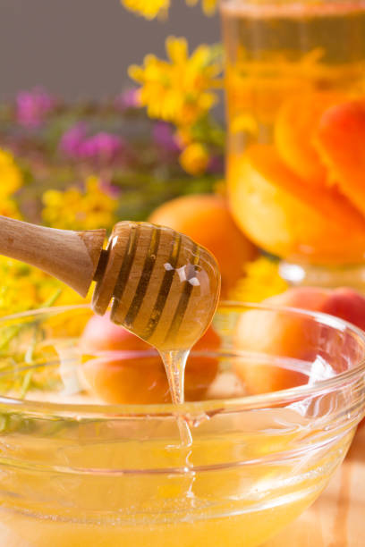 istock Honey stick and a glass jar 1000037058