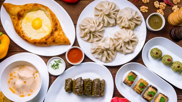 Georgian cuisine foodset from khachapuri, khinkali, pkhali, dolma, satsivi top view