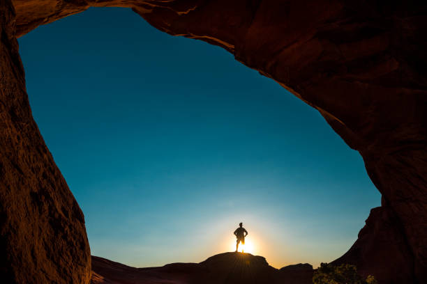 istock Hiker dwarfed by Turret Arch 1000075102