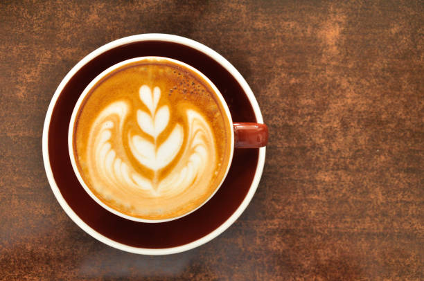 istock A cup of hot latte coffee on wood table 1000078932