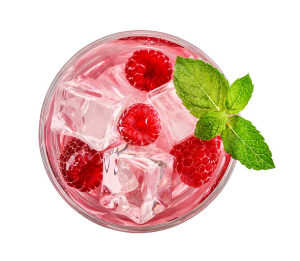 Glass of pink soda drink Glass of pink soda drink with ice and raspberry isolated on white background, top view carbonated juice stock pictures, royalty-free photos & images