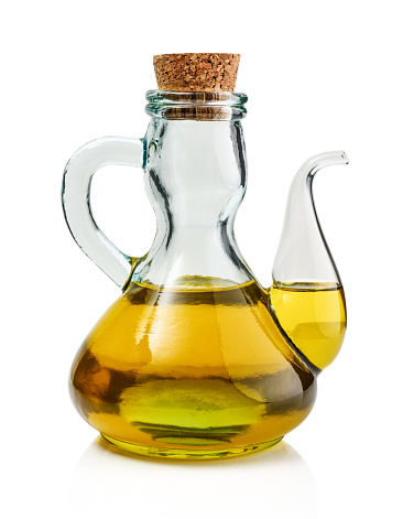 Olive oil in bottle isolated on white background with clipping path