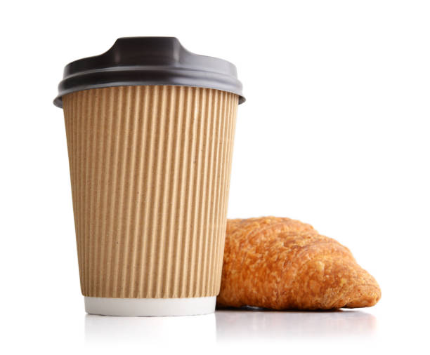 istock Take away coffee and fresh croissant 1000092786