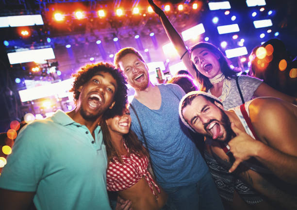 istock Friends dancing at a concert. 1000109606