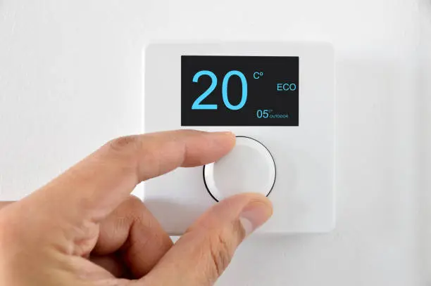 One hand adjust thermostat digital in celsius at home