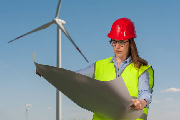 istock Concept of engineers and windmills 1000127576