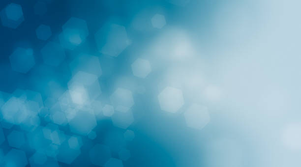 istock Blue hexagon bokeh on black background blurred light, Abstract blurred gradient background in bright colors. 1000128386