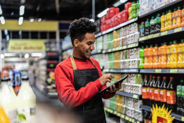 istock Businessman checking inventory in a digital tablet at a supermarket 1000133198