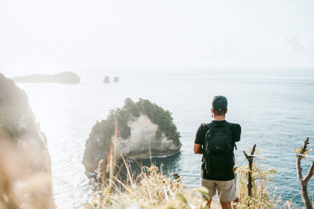 istock A man with looking at the ocean in bali 1000133664