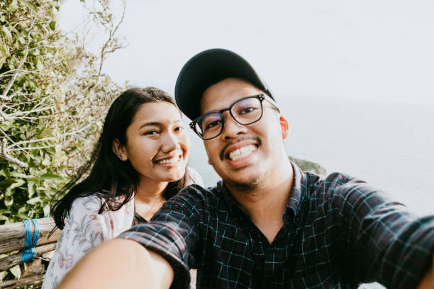 istock Young Couple Pose For Holiday Selfie, in Bali 1000147254