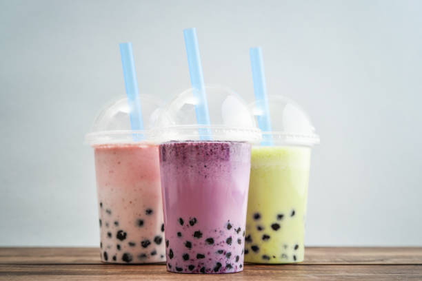 Take away drinks concept. Various Bubble Tea in a plastic cups with drink straws on blue background. Take away drinks concept. bubble tea photos stock pictures, royalty-free photos & images