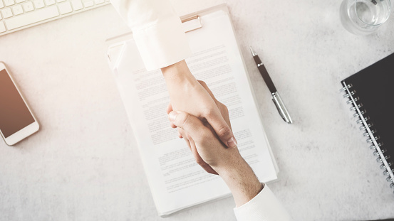 Business people shaking hands in office