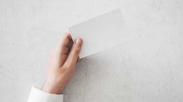istock Hand holding a blank business card 1000173690