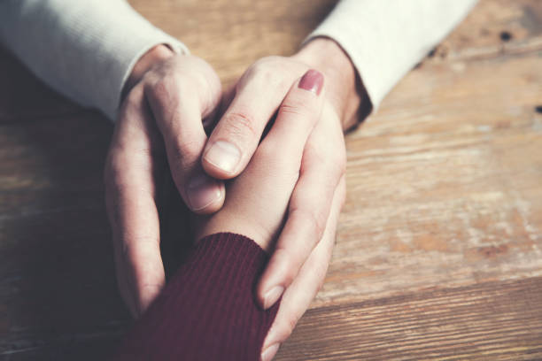 istock woman and man hand 1000184590