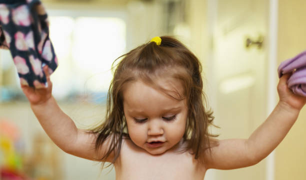 istock Baby Girl Plays at Home 1000188934