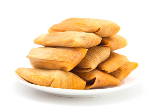 Homemade Wrapped Tamales on a White Background stock photo