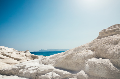 Idyllic white rock formations in Sarakiniko beach in Milos (Cyclades, Greece). Panoramic view.
