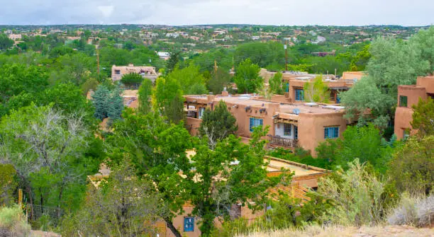 Pueblo style homes on a hillside in Santa Fe, NM.