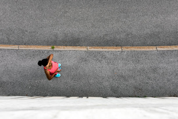 istock Overhead view of a jogger resting 1000238340