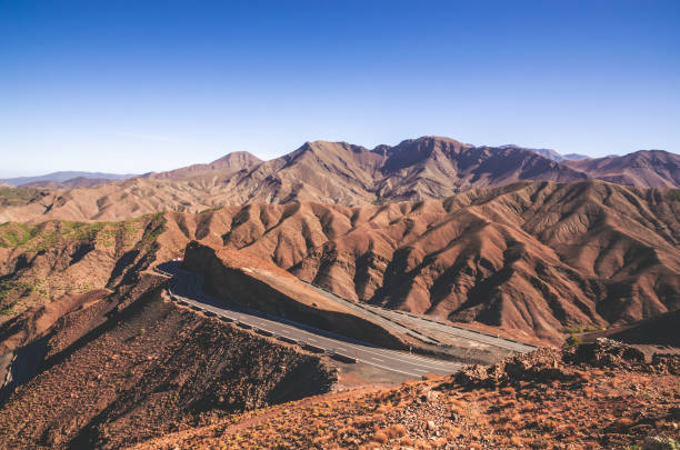 istock Desert road with Atlas Mountains, Morocco 1000242174