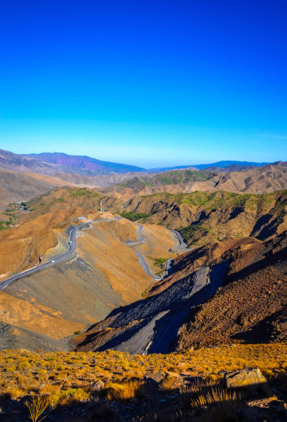 istock Desert road with Atlas Mountains, Morocco 1000242180