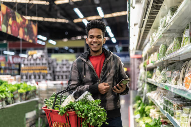 istock Customer Buying Greens on Supermarket 1000250046