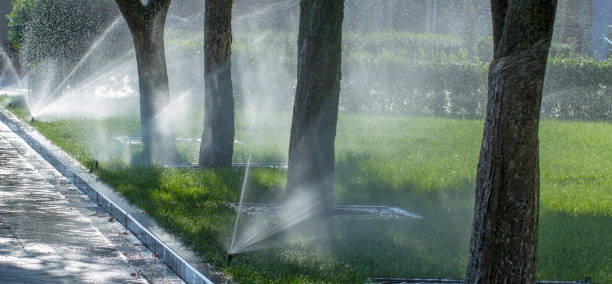 istock automatic sprinkler system watering the lawn on a background of green grass 1000250470