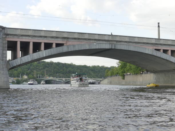 istock Bridge over the Vltava River. The ship sails by Vltava River. 1000256300
