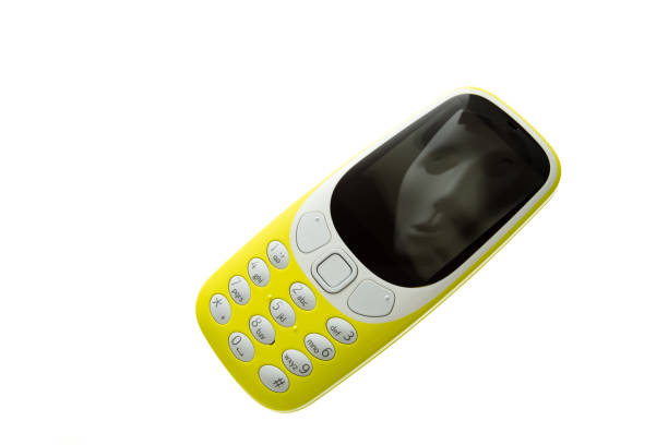 istock Mobile classic phone with facial reflection in the mask 1000259566