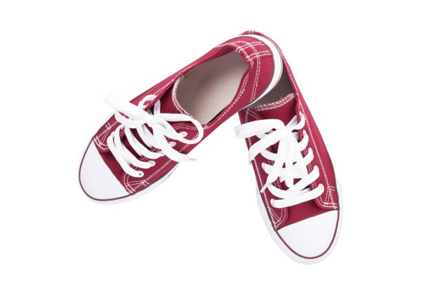 istock Red sneakers top view isolated on white background 1000267174