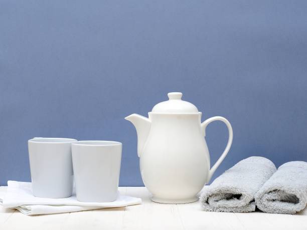 istock Pair White Cups and Teapot on the Table in the kitchen.Indoor Interior. Scandinavian style. Love Concept. 1000291752