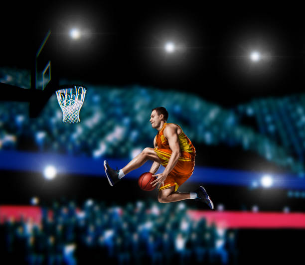 istock basketball player making slam dunk on basketball arena 1000302192