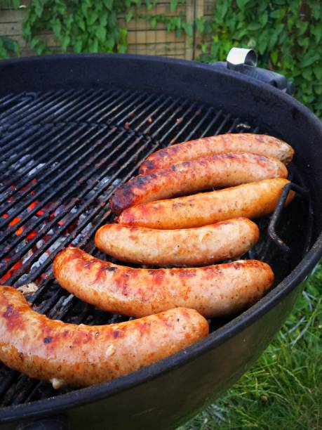 istock Kettle grill barbecue sausages 1000304928