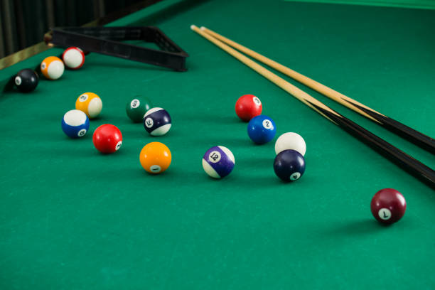 istock Billiard balls on green table with billiard cue, Snooker, Pool g 1000309368