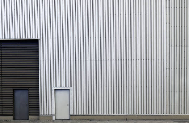 istock Metallic wall with striped line texture with closed doors. 1000348142