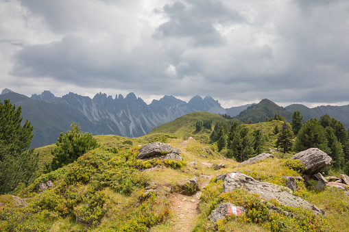 A little path for hiking in the austrian alps with the kalkkögel in the background.