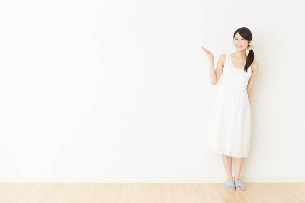 Asian woman pointing side