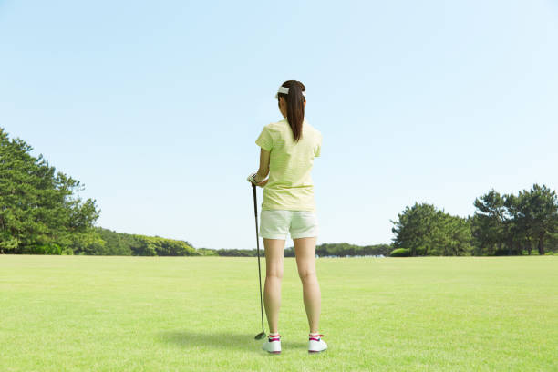 Japanese golfer standing on the golf course