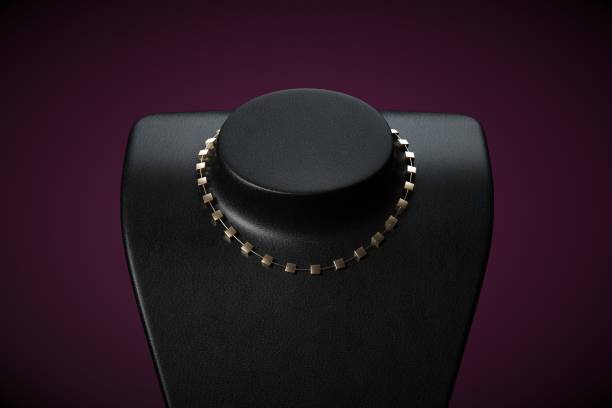 istock Golden necklace on black studio background 1000379436