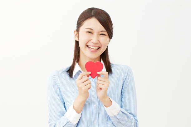 istock Asian woman with heart 1000380058