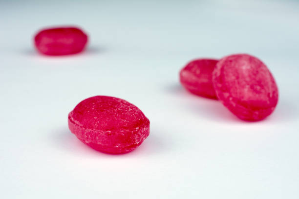 istock red lollipops white background selective focus closeup 1000392168