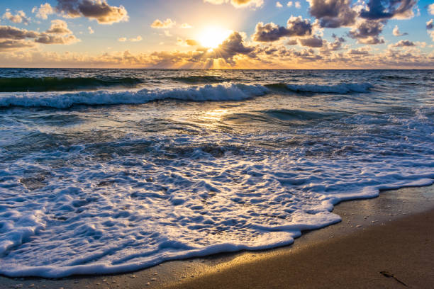 istock Waves crashibg in the shore just after sunrise 1000406218