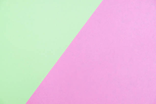 istock Pastel colored paper flat lay top view, background texture, green and pink 1000410788