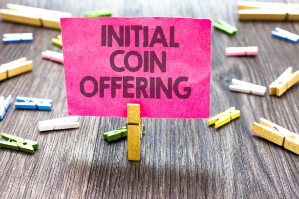 istock Writing note showing Initial Coin Offering. Business photo showcasing crowdfunding using cryptocurrencies raising capital Multiple clips woody table small card clipped notice announcement. 1000437624